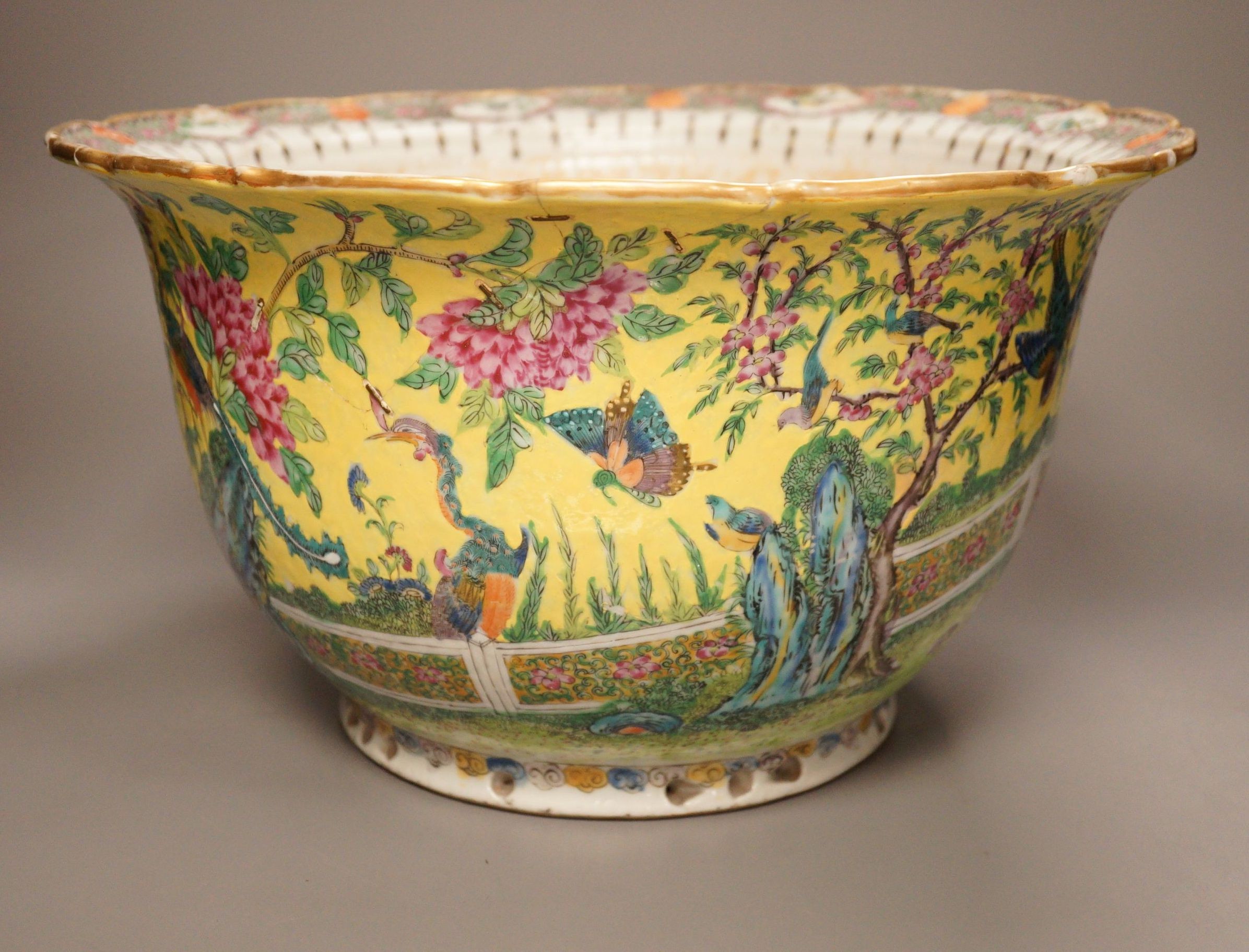 An early 20th century Chinese famille rose yellow ground jardiniere, a.f, 37cm